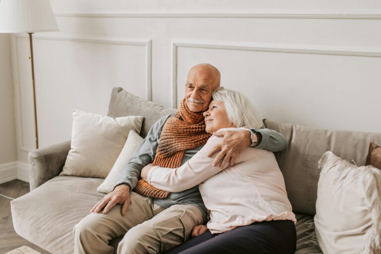 Senior couple providing comfort for one another.